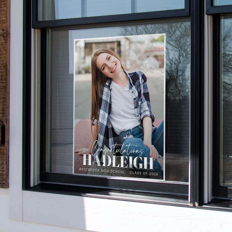 An 24x18 vertical yard sign for a graduate in a window