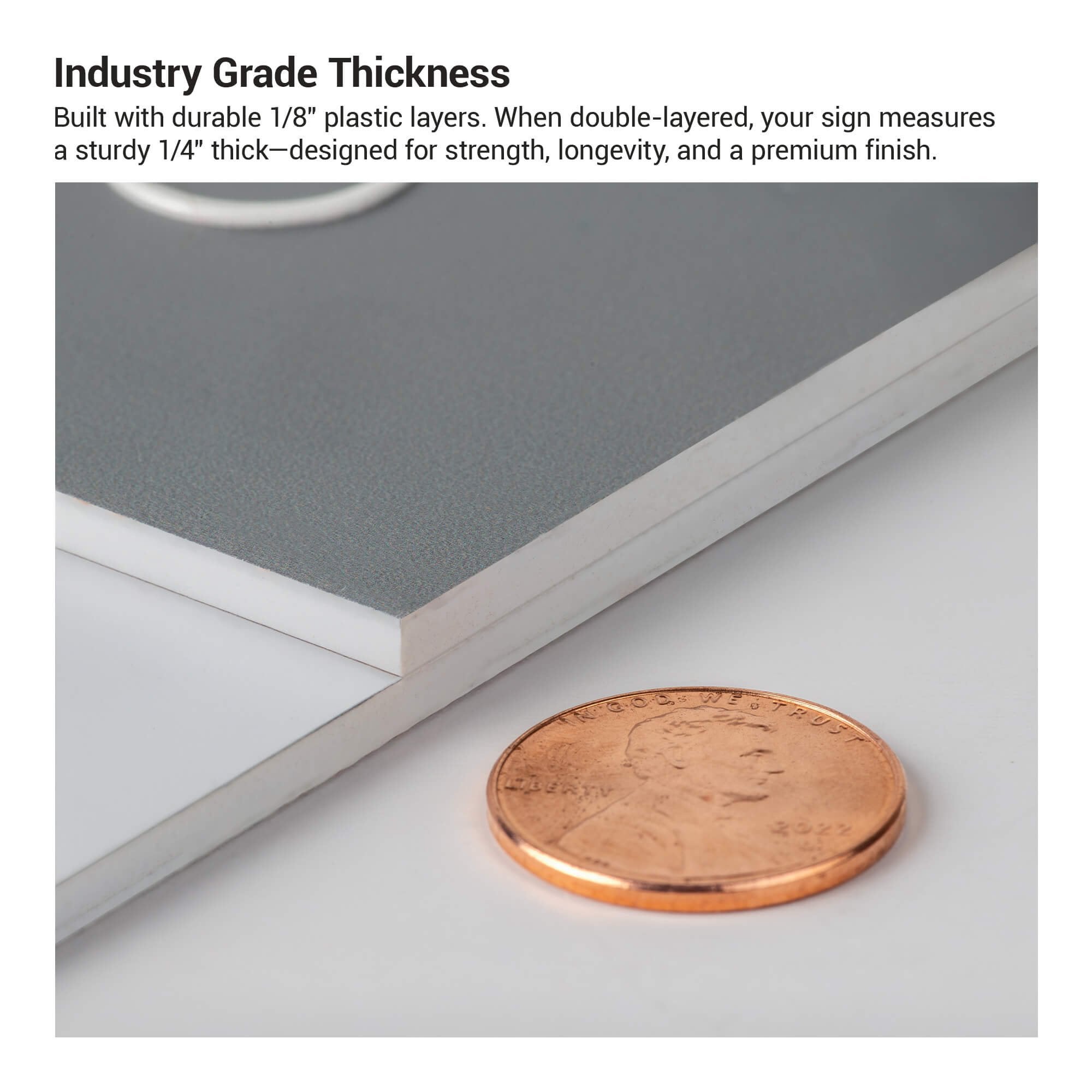 The thickness of the 2-layer round ADA sign compared to a US penny The thickness of the 2-layer round ADA sign compared to a US penny