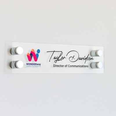 Custom clear acrylic sign with a logo and a name
