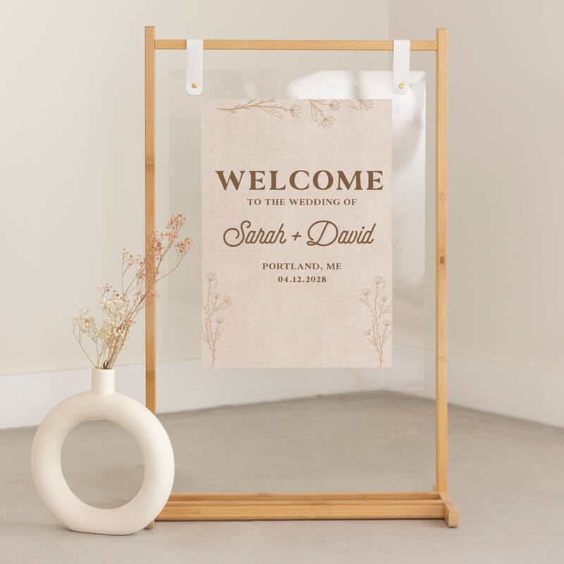 Clear acrylic wedding sign with couple's name and wedding information