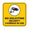 Yellow No Soliciting sign reading "Security Cameras in Use" with a security camera icon