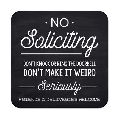 Black No soliciting sign that reads “Don’t knock or ring the doorbell…. friends & deliveries welcome” in white