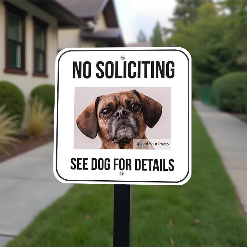 No soliciting sign with a custom pet photo reading, "See dog for details on a yard stake. 