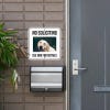No soliciting sign with a custom pet photo of a white Lab retriever reading, "See dog for details," hung on a wall 
