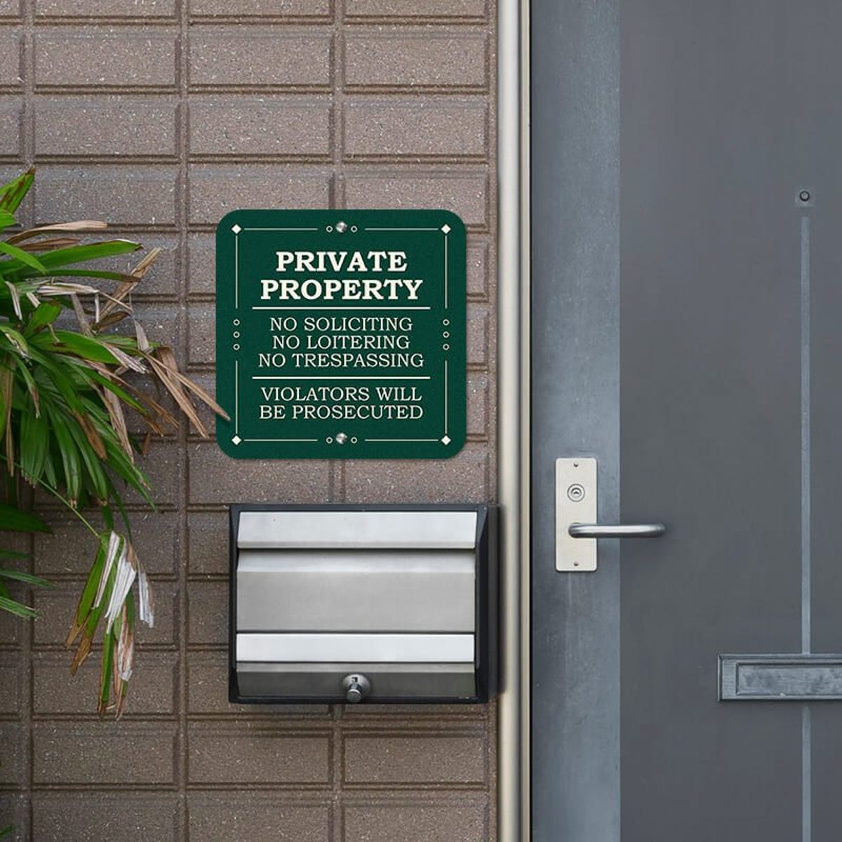 Private property, no soliciting. loitering or trespassing sign reading Violators will be prosecuted next to the front door