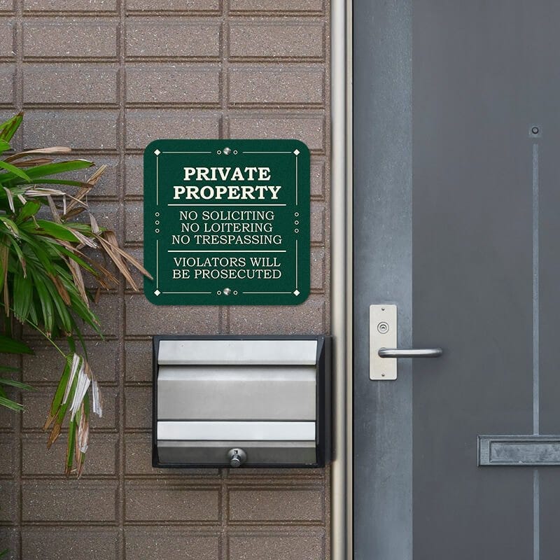 Private property, no soliciting. loitering or trespassing sign reading Violators will be prosecuted next to the front door