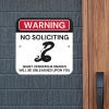 Funny no soliciting sign warning of venomous snake with icon of black snake hung on wall