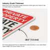 ndustry-grade aluminum signage shown with thickness measurement beside a U.S. penny