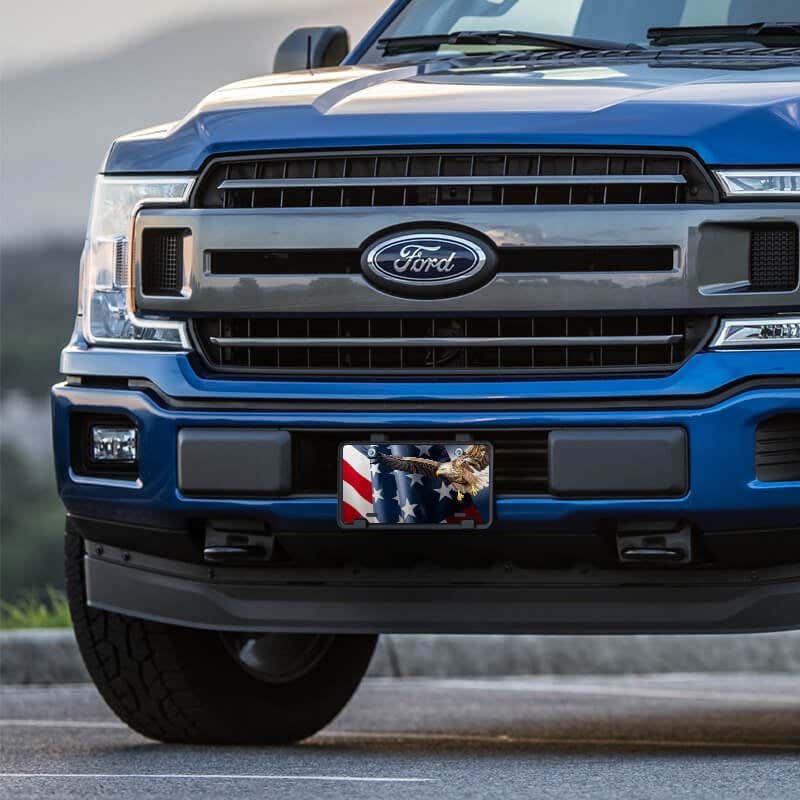 American Flag and Eagle front license plate on a blue truck