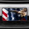 A close up of the American Flag and Eagle front license plate on a white car
