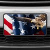 A close up of the American Flag and Eagle front license plate on a white car