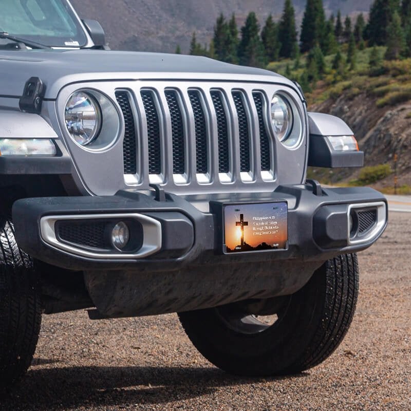 All Things Through Christ front license plate on a Jeep