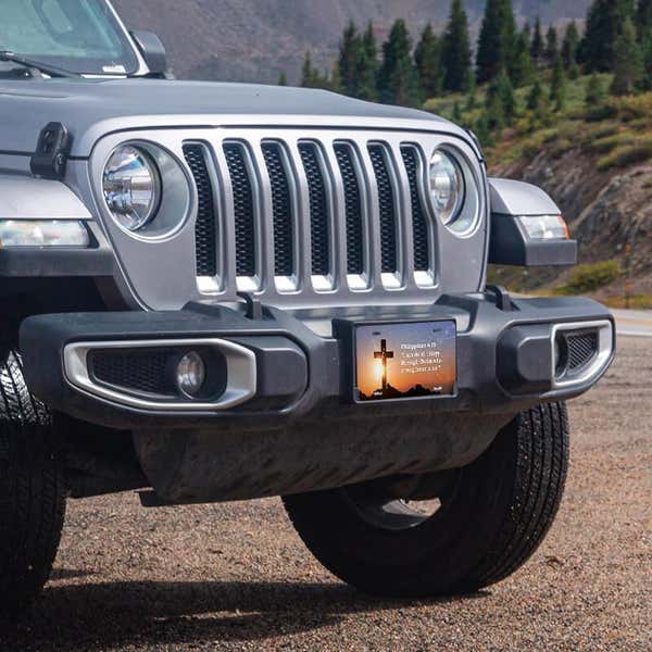 All Things Through Christ front license plate on a Jeep