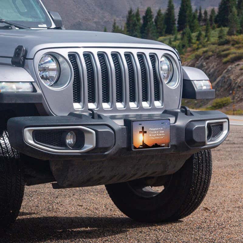 All Things Through Christ front license plate on a Jeep