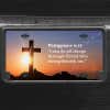 A close up of the All Things Through Christ front license plate on a black car
