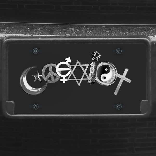 A close up of the Coexist front license plate on a black car