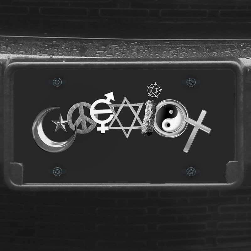A close up of the Coexist front license plate on a black car