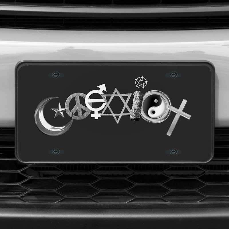 A close up of the Coexist front license plate on a white car