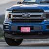 Curbs Fear Me front license plate on a blue truck