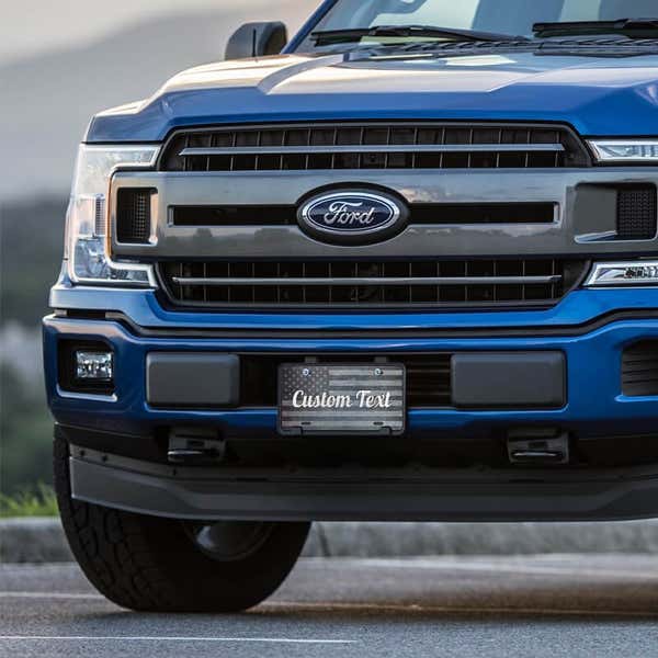 Custom American Flag front license plate on a blue truck