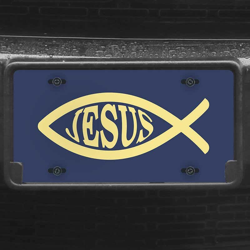 A close up of the Jesus Fish Ichthys front license plate on a black car