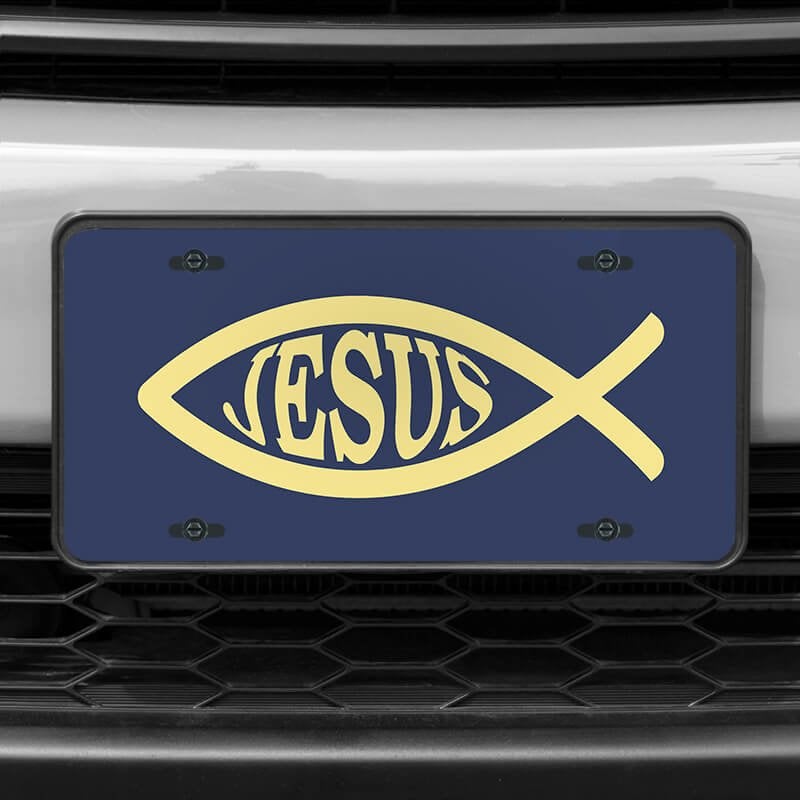 A close up of the Jesus Fish Ichthys front license plate on a white car