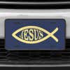 A close up of the Jesus Fish Ichthys front license plate on a white car