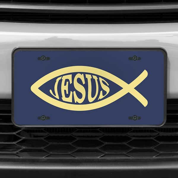 A close up of the Jesus Fish Ichthys front license plate on a white car