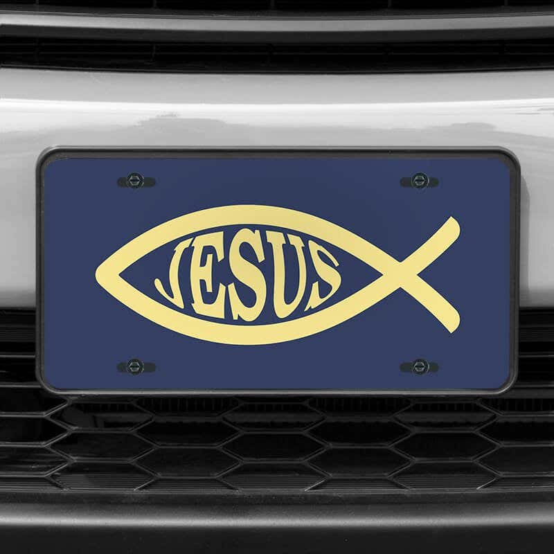 A close up of the Jesus Fish Ichthys front license plate on a white car