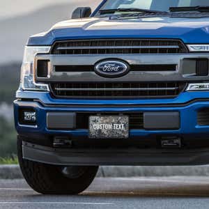 Custom Military Camo front license plate on a blue truck