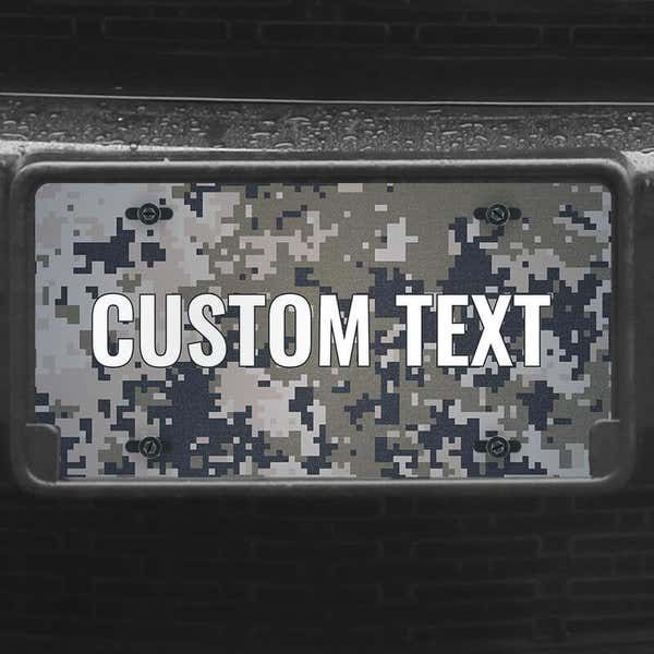 A close up of the Custom Military Camo front license plate on a black car