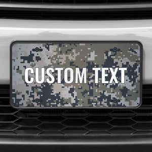 A close up of the Custom Military Camo front license plate on a white car