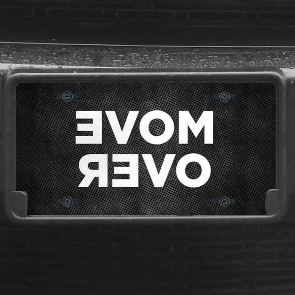 A close up of the Move Over front license plate on a black car