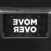 A close up of the Move Over front license plate on a black car