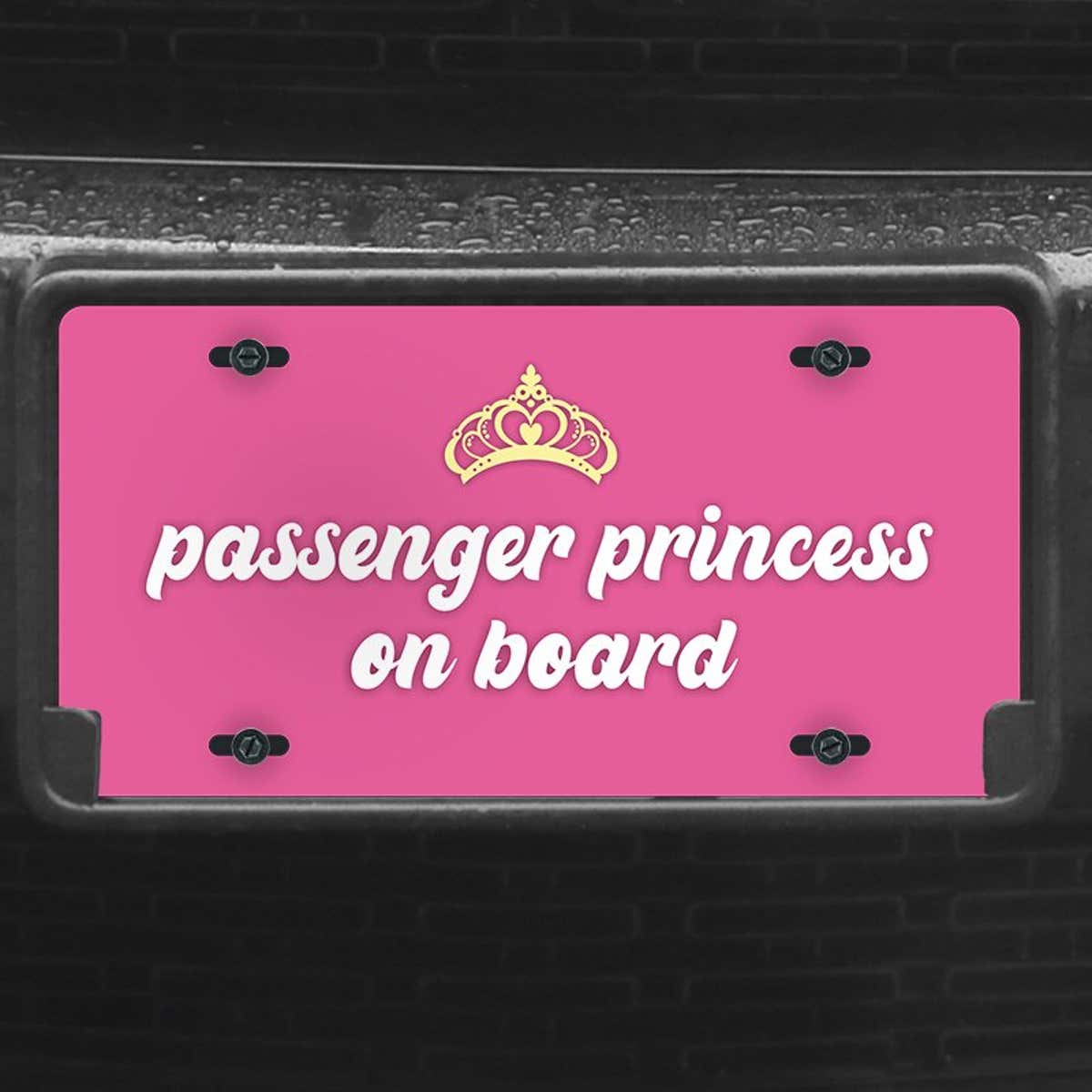 A close up of the Passenger Princess front license plate on a black car