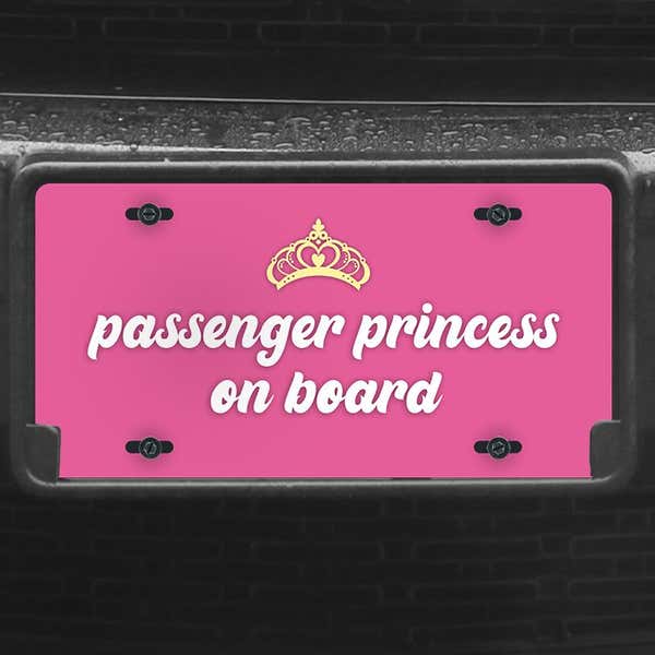 A close up of the Passenger Princess front license plate on a black car