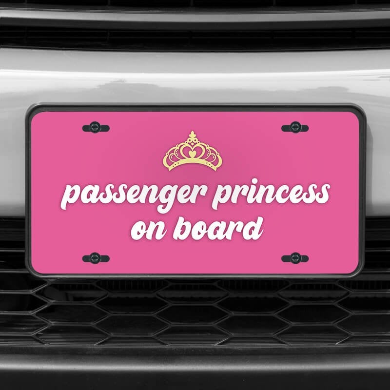 A close up of the Passenger Princess front license plate on a white car
