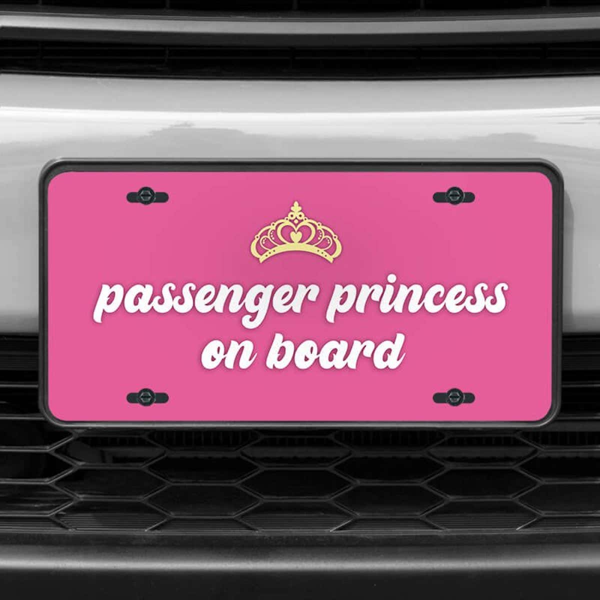 A close up of the Passenger Princess front license plate on a white car