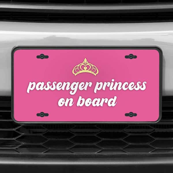 A close up of the Passenger Princess front license plate on a white car