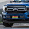 LGBTQ Pride front license plate on a blue truck