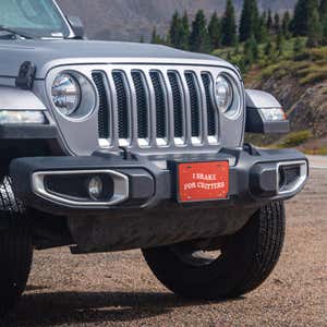 I Brake For Critters front license plate on a Jeep