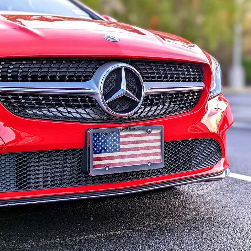 American Flag Patriotic front license plate on a red car