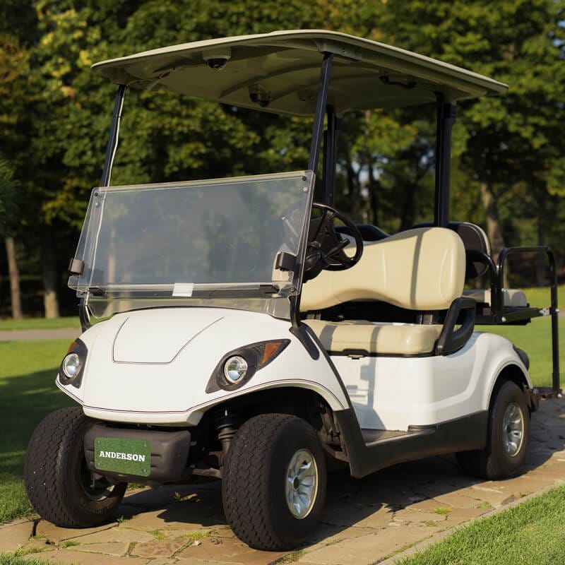White Golf Cart with a Custom License Plate Saying "Anderson"
