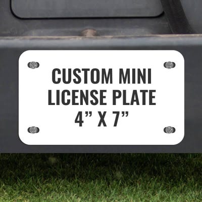 Custom Mini License Plate for Golf Carts 4x7 Shown on a Gold Cart