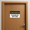 Out of Service Sign on a wooden door