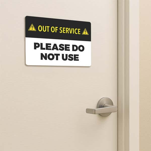 Out of Service Sign of a bathroom door