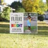 Future is bright graduation yard sign displayed in a sunny yard