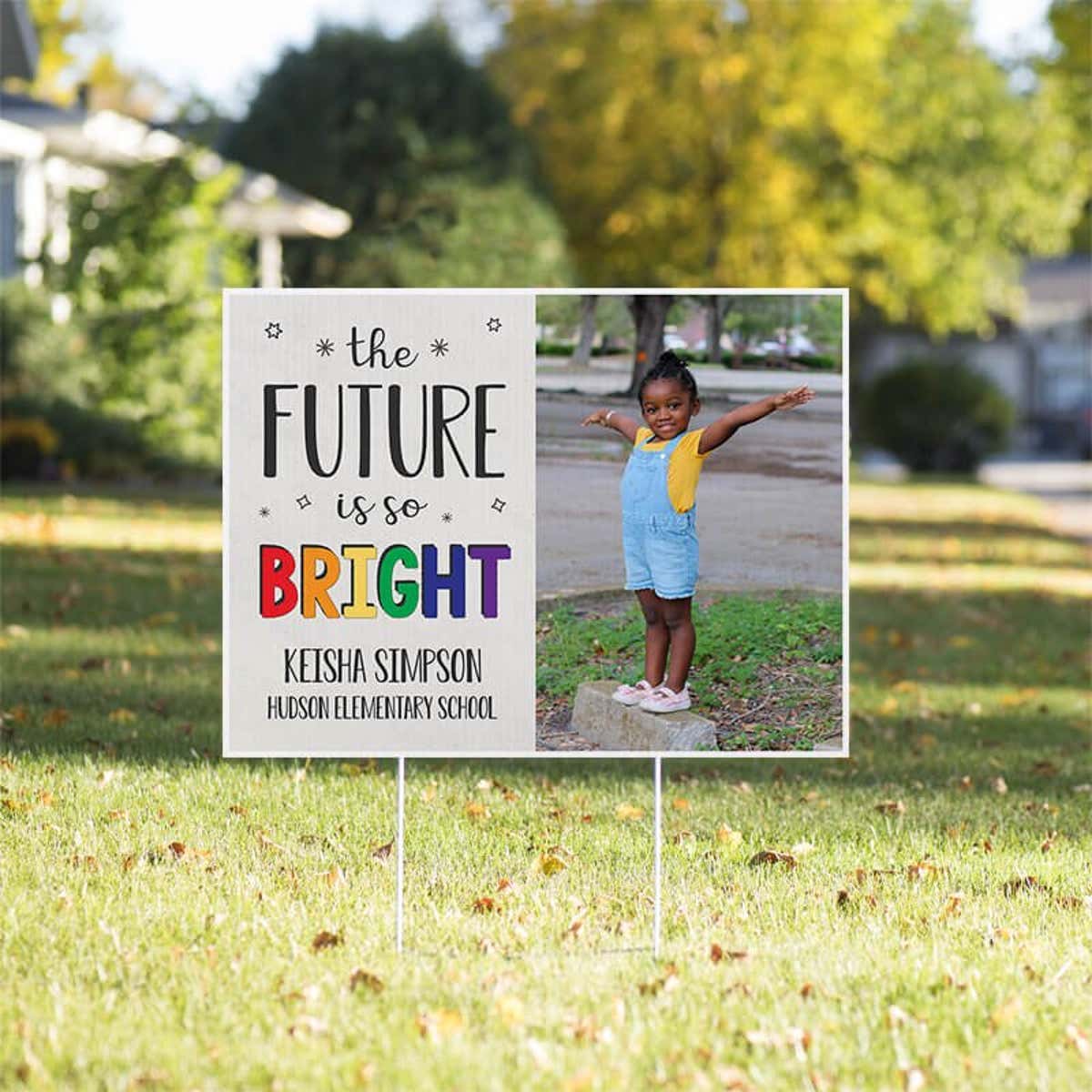 Future is bright graduation yard sign displayed in a sunny yard
