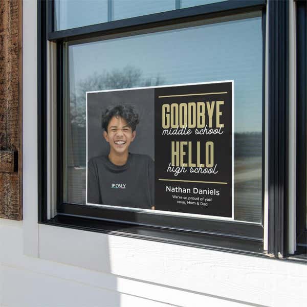 Goodbye middle school graduation yard sign displayed in a window