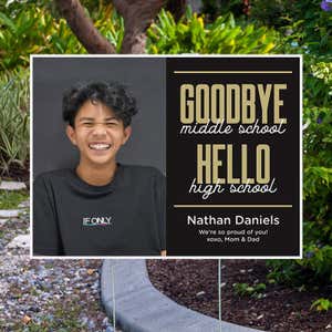 Goodbye middle school graduation yard sign displayed next to pavement